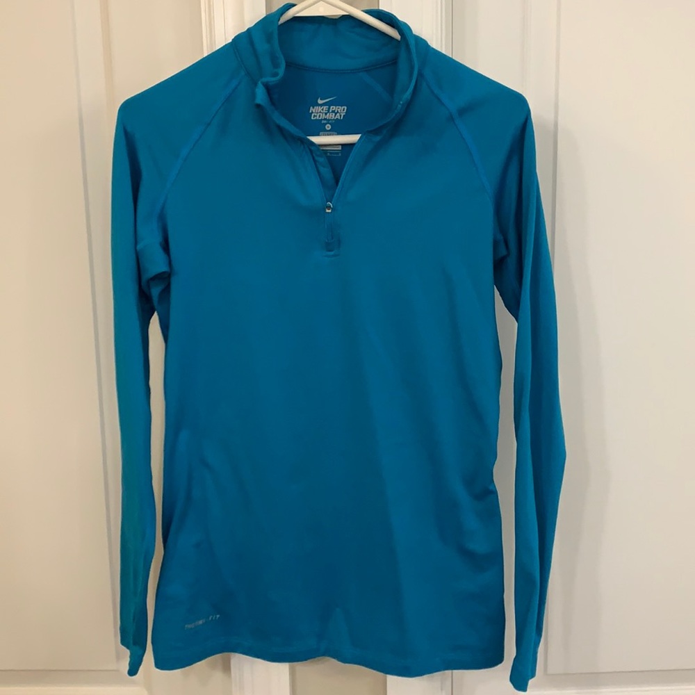 Nike fitted ladies size med therma fit top. Finger hole in sleeve. Very warm!